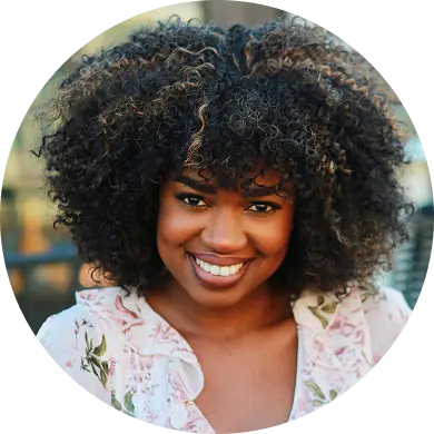 Smiling woman with dark curls